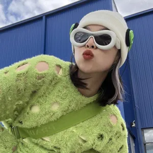 Detailed close-up of Y2K white inflatable frame sunglasses on model for trendy styling