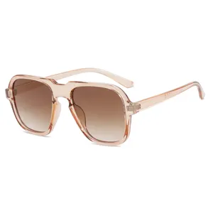 Retro navigator sunglasses with transparent peach frame and brown gradient lenses for men