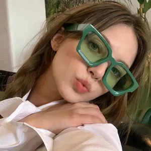 Vintage green square frame sunglasses for women featuring durable metal hinges