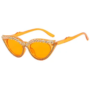 Orange cat eye sunglasses with rhinestone embellishments for fashion and party wear