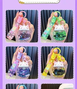 Cute liquid quicksand lucky cat keychain with strap, sparkling glitter variant charm pendant.