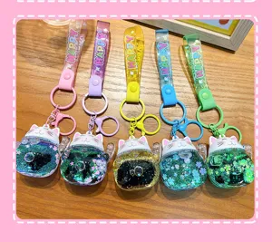 Cute liquid quicksand lucky cat keychain pendant with colorful straps, ideal gift.
