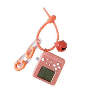 Mini handheld game console keychain with bell and silicone loop pendant for bags