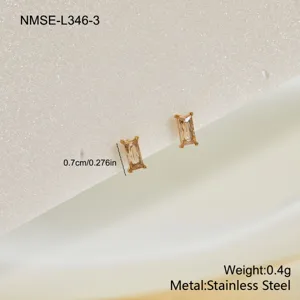 Detailed macro view of champagne baguette zircon stud earrings in gold stainless steel