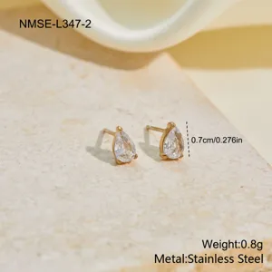 Macro view of teardrop zircon stud earrings with 0.7cm size scale and weight data