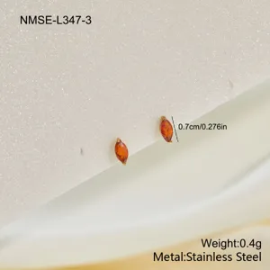 Detailed macro view showing orange marquise-cut zircon stud earrings in stainless steel