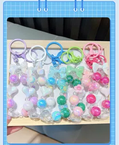 Colorful handmade acrylic beaded keychain set with cute heart and bow charms for bags