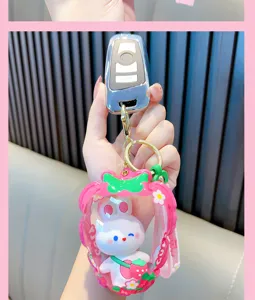 Cute white bunny rabbit inside a strawberry inflatable pouch keychain charm for bags