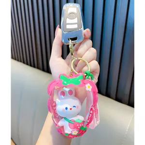 Kawaii white rabbit character in pink strawberry inflatable pouch keychain accessory