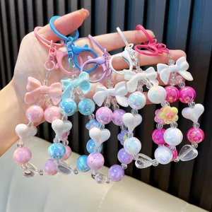 Cute set of colorful acrylic beaded keychains with bows and hearts for bag accessories