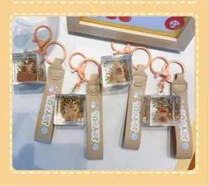 Simpatici portachiavi capibara con glitter liquidi e cinturino in pelle per borse