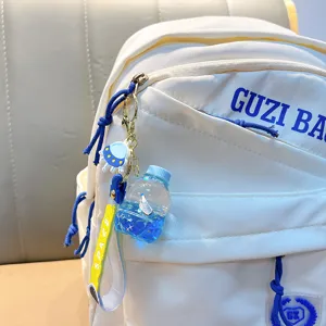 Kreativer Schlüsselanhänger mit blauem Segelboot und flüssiger Treibsandflasche für Taschen