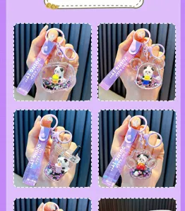 Detail view of four cartoon panda liquid glitter keychains in purple