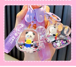 Close-up of cute cartoon panda liquid glitter keychain with purple straps