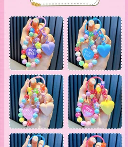Detailed view of colorful acrylic beaded heart keychains with For Ever charms