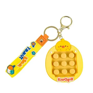 Yellow cartoon duck pop-it fidget toy keychain with silicone strap and 3x3 bubbles