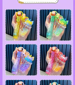 Detail view of four cat ear bubble tea cup keychains featuring colorful moving beads