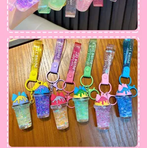 Detail of six colorful bubble tea cup keychains with moving beads and cat ears