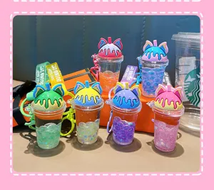 Detail view showing various colors of oil-filled bubble tea cup keychains with cat ears