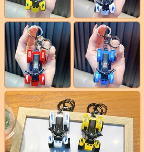 Detailed view of colorful mini ATV keychains in red, blue, white, and yellow