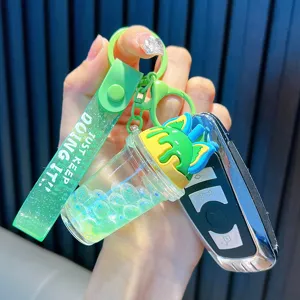 Unique milk tea cup keychain featuring flowing oil and colorful bubble beads decor