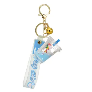 Portachiavi tazza bubble tea con liquido blu, unicorno carino e campanellino oro
