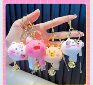 Detailed view of cute cartoon animal nail clipper and ear pick keychain set in four designs