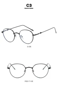 Detail view of round black metal sunglasses from side and positive angles