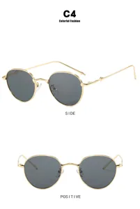 Detailed view of small round sunglasses with gold metal frame and dark lenses