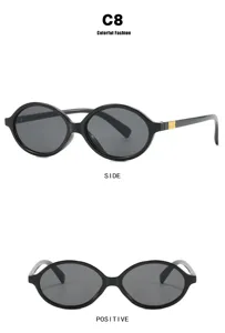 Detailed side and front views of vintage oval black eyeglass frames with gold accents