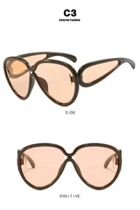 Futuristic oversized hip-hop sunglasses detail view showing both side and front angles