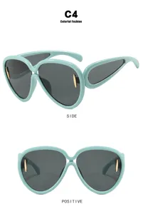 Futuristic mint green oversized sunglasses with grey lenses showing side and front views