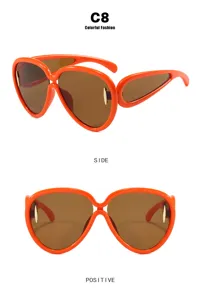 Detailed side and front views of orange oversized futuristic sunglasses with brown lenses
