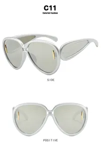 Futuristic silver oversized sunglasses for women shown in both side and front views.