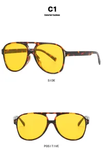 Detailed side and front views of yellow lens sunglasses with tortoise shell frames