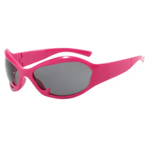 Trendy pink Y2K futuristic sunglasses with grey lenses for hip-hop styling