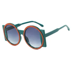 Stylish oversized round sunglasses in green and orange for trendy fashion styling and parties