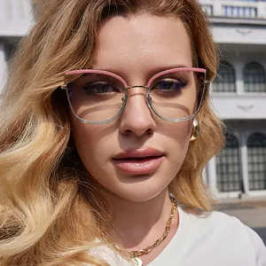 Close-up of stylish cat-eye anti-blue light glasses worn by a female model outdoors