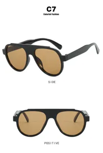 Professional detail view of black oversized aviator sunglasses with brown lenses