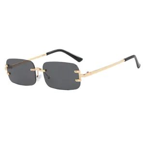 Trendy rimless rectangular sunglasses with gold-toned metal temples and dark lenses