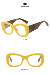 Montura de gafas amarilla moderna con patillas jaspeadas mostrada en dos ángulos.
