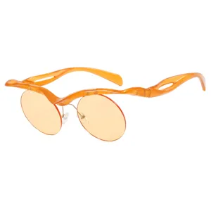 Gafas de sol redondas de media montura naranja para mujer con montura ondulada de moda