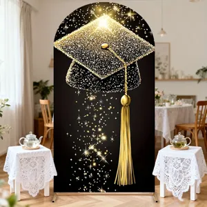 Elegant arched graduation backdrop with black and gold glittery cap for ceremony decor