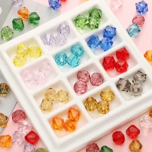 Detailed macro shot of various 10mm colorful faceted crystal beads in a sorting tray.