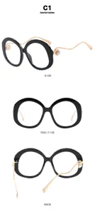 Detailansicht der runden schwarzen Retro-Brille mit Perlenakzenten und goldenen Bügeln.