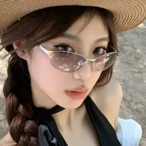 Stylish Asian woman wearing retro futuristic cat-eye sunglasses with metal frame