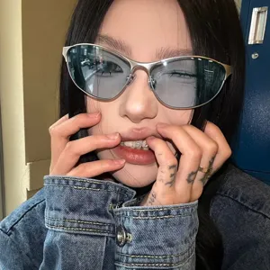 Trendy futuristic metal cat-eye sunglasses for women with a vintage Y2K aesthetic.