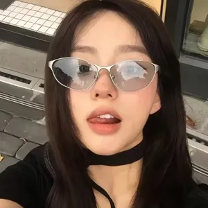Stylish vintage futuristic metal cat-eye sunglasses for women shown on a model
