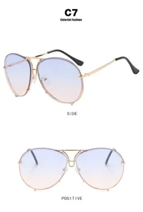 Multiple views of oversized aviator sunglasses with purple-to-pink gradient lenses and gold frame