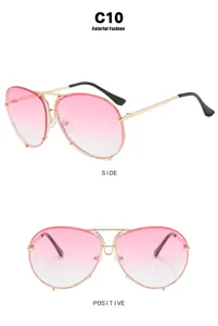 Oversized aviator sunglasses with pink gradient lenses and gold metal frame details
